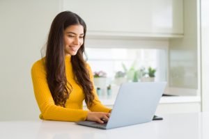 happy young woman has an online therapy session for depression in Virginia with Nova Terra Therapy 