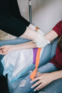 photo of person giving blood representing the sacrifice health care workers and their spouses are making. For tips on how to handle anxiety try online therapy in VA with Nova Terra Therapy 22015